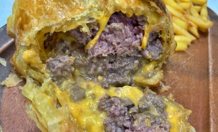 Wellington burger cut open with oozing cheese